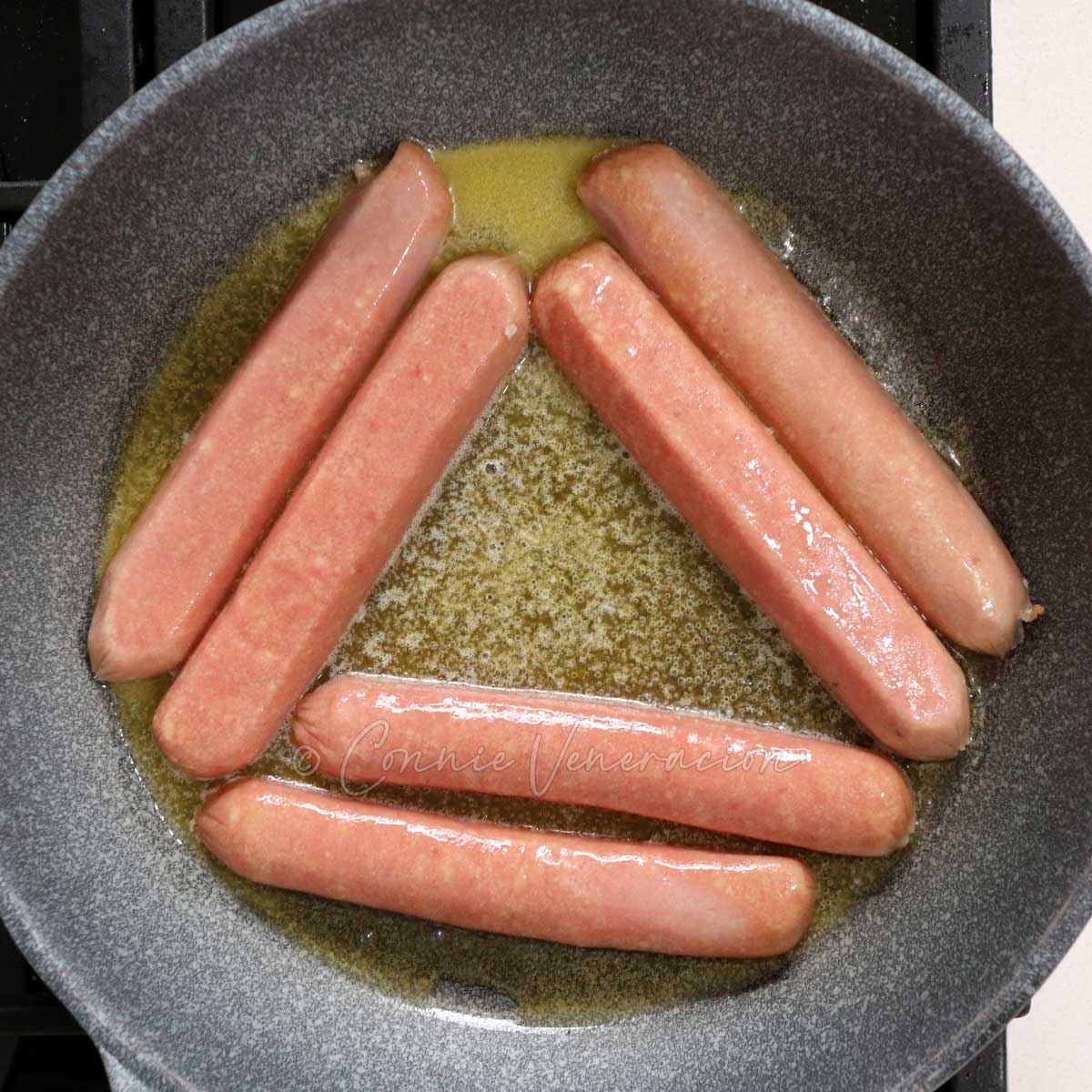 Browning split sausages in butter