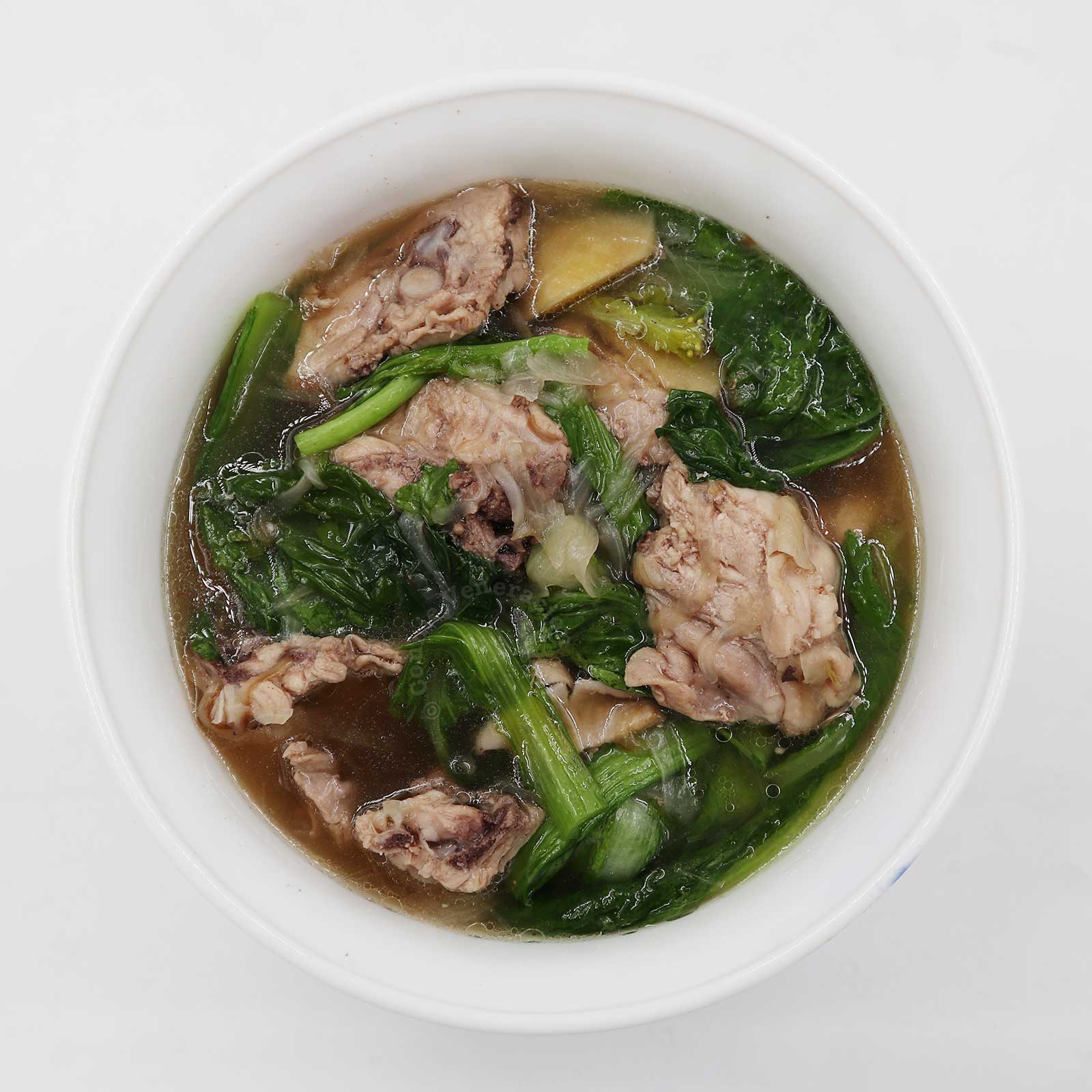 Chicken soup with mustard greens (leaves)