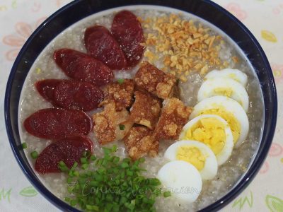 Congee with Chinese sausage, crispy pork belly, egg, scallions and toasted garlic