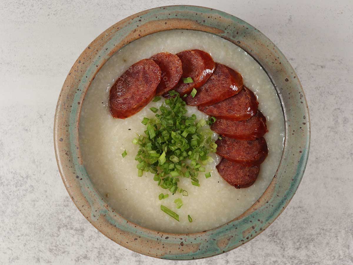 Sliced Chinese sausage on top pf congee