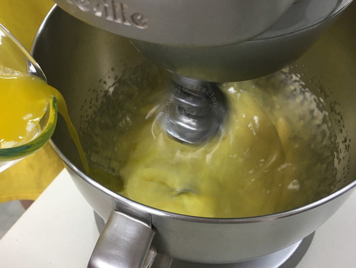 Emulsifying melted butter and raw egg yolks to make Hollandaise sauce