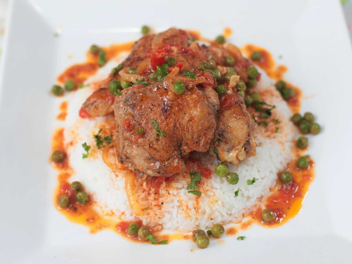 Chicken stewed in tomato cream sauce served over rice