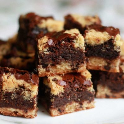 Chocolate Chip Cookie Dough Brownies Stacked on White Plate