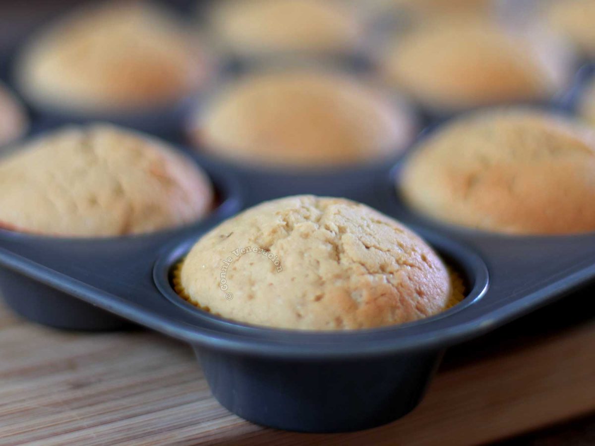 Newly baked uniform-sized cupcakes in pan