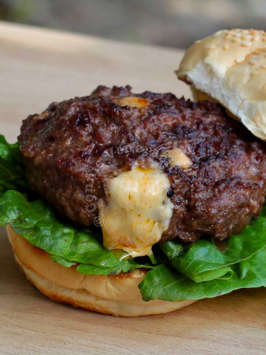 Grilled burger with cheese oozing out