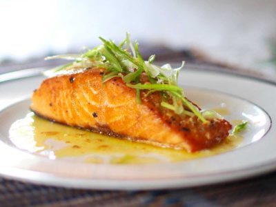 Pan-grilled Salmon With Lemon-butter-garlic Sauce in White Plate