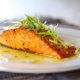 Pan-grilled Salmon With Lemon-butter-garlic Sauce in White Plate