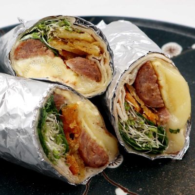Breakfast Sausage Burrito with Cheese Omelette, Crispy Potatoes and Alfalfa Sprouts