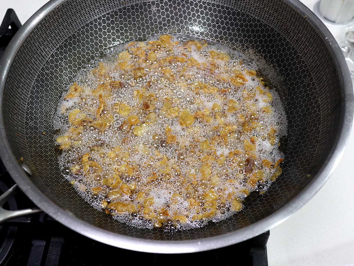 Browned buts of pork fat frying in rendered fat