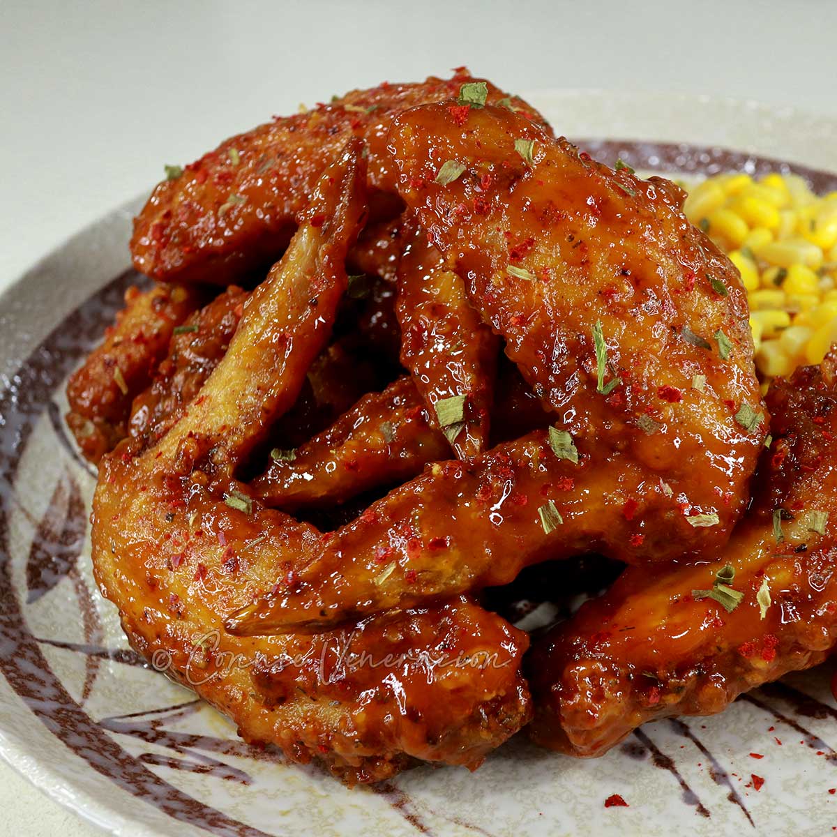 Cajun fried chicken wings with sweet corn on the side