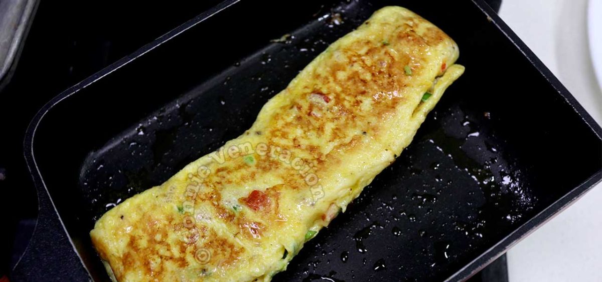 Omelette rolled to form a log