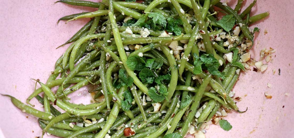 Haricot vert (French green bean) salad topped with mint leaves