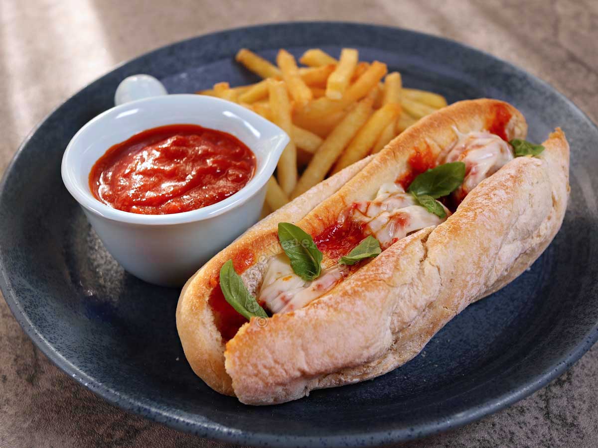 Meatball sub with fries and tomato sauce for dipping