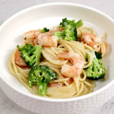 Creamy shrimp broccoli spaghetti in white bowl