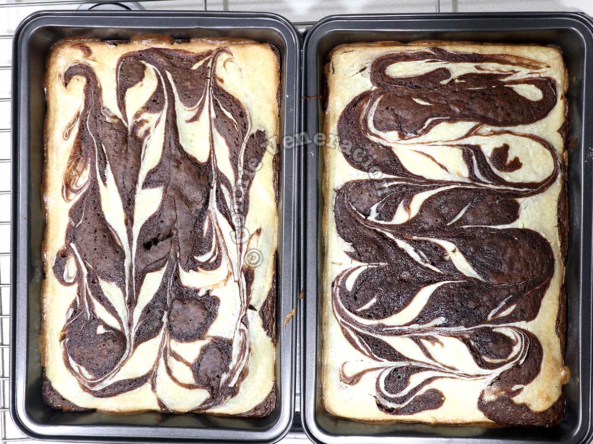 Two pans of cheesecake brownies from the oven