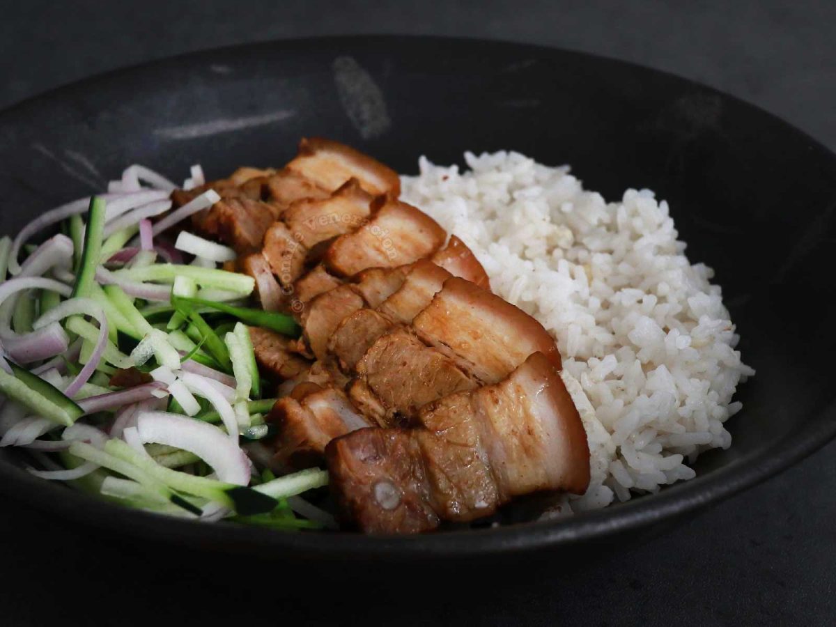 Three soy sauce pork belly (tau yu bak in Hokkien cuisine) with rice and vegetables