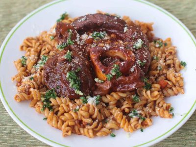 Osso buco served with pasta
