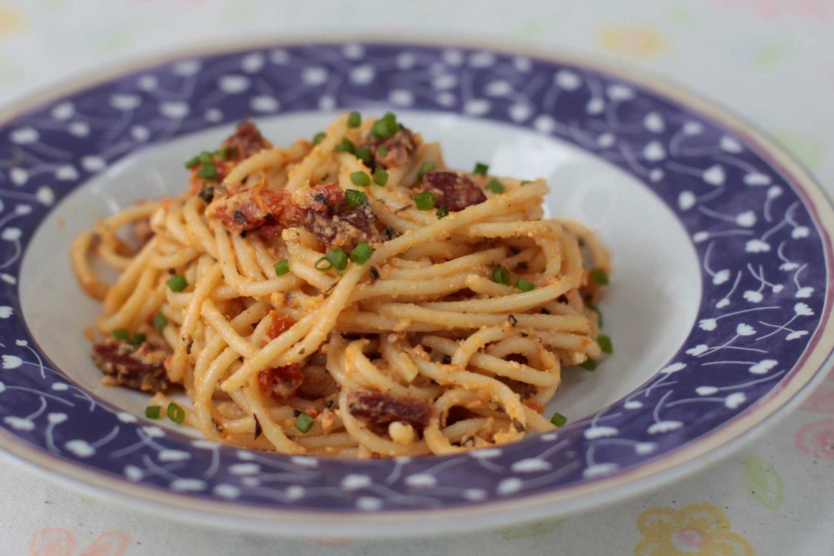 Salted duck egg and chorizo spaghetti in bowl