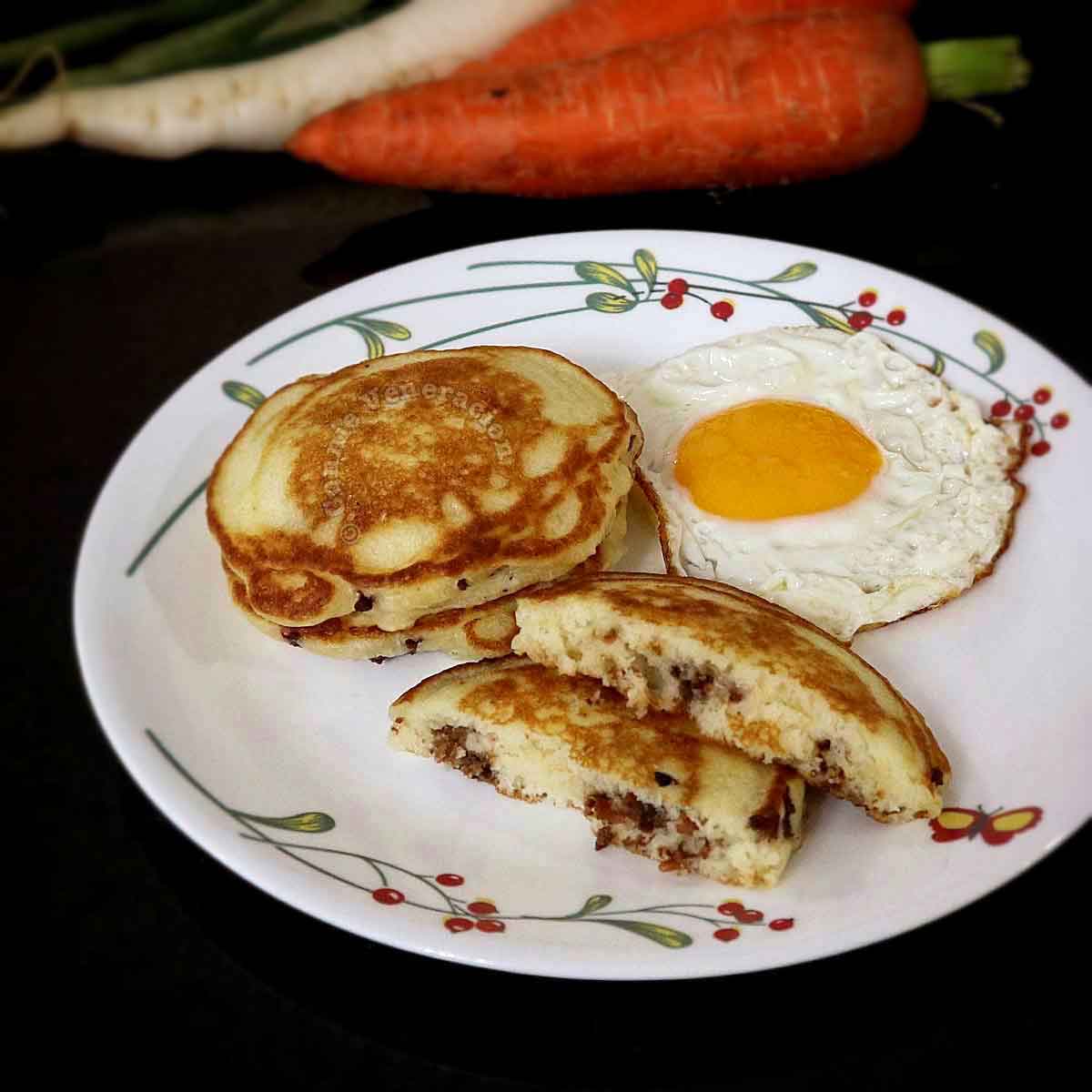 Longganisa (sausage) pancakes and egg on plate