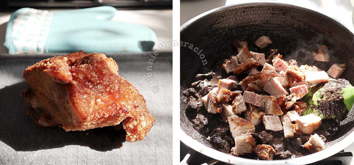 Adding cubes of bagnet (Ilocano crispy pork belly) to the blood stew in the pan