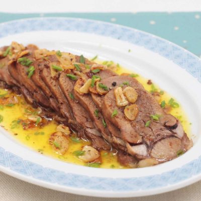Lengua al Ajillo (Spanish-style Beef Tongue with Garlic) on Serving Plate