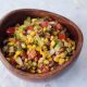 Corn and bean salad in wooden bowl