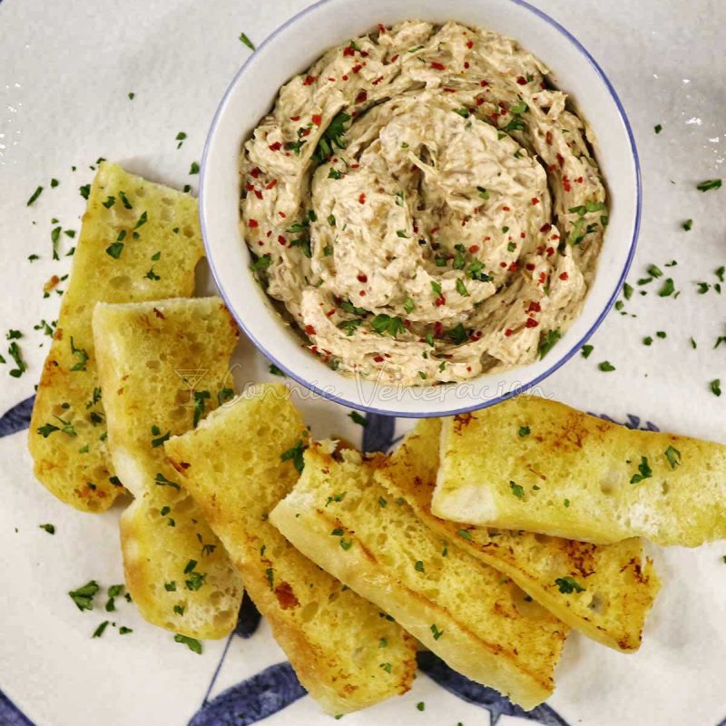 Slow Cooker Caramelized Onion and Cheese Dip Sprinkled with Parsley and Chili Flakes