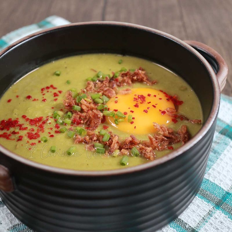 Fresh pea soup with egg yolk, fried shallots, scallions and chili flakes