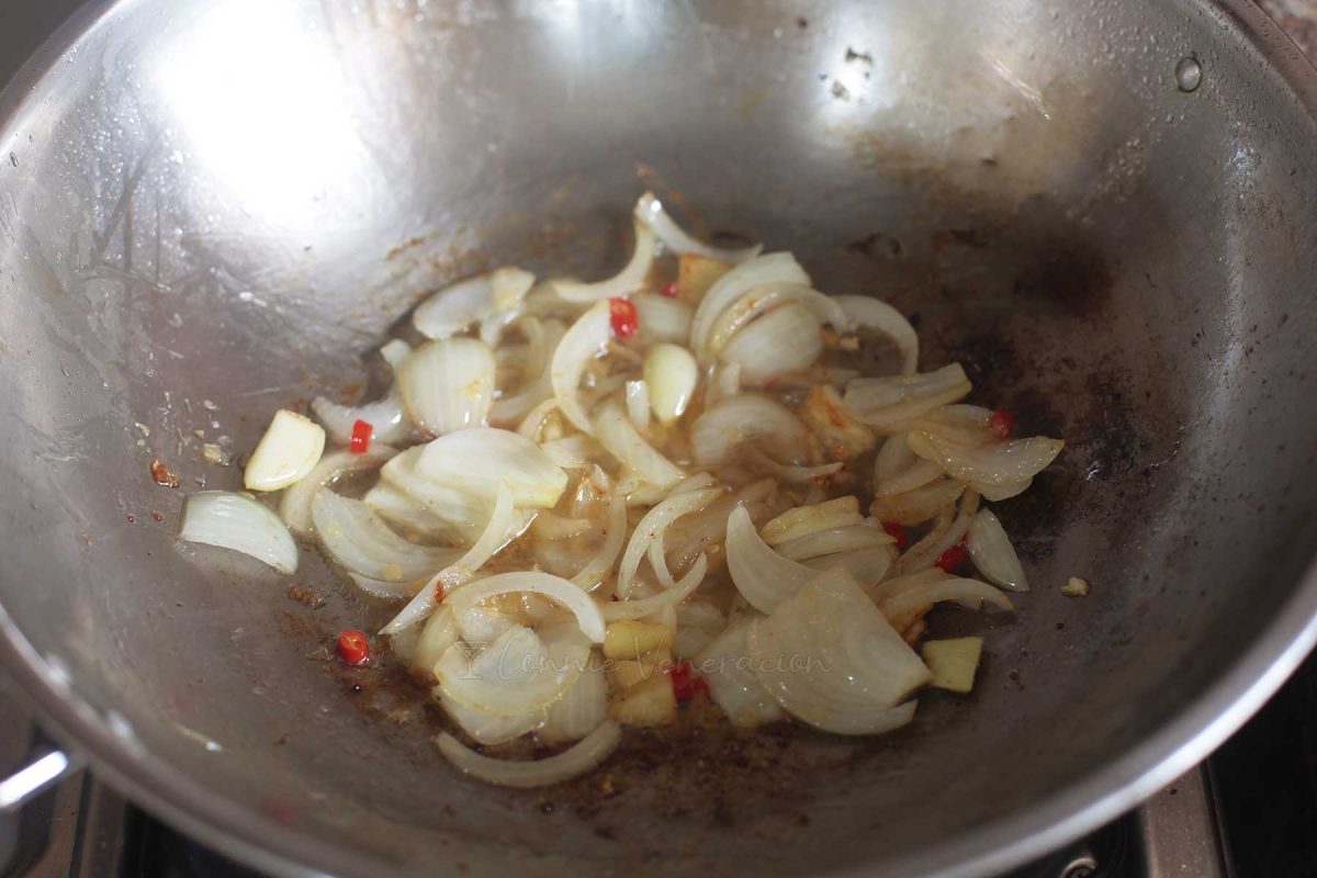 Sauteeing onion, garlic, ginger, lemongrass and chilies