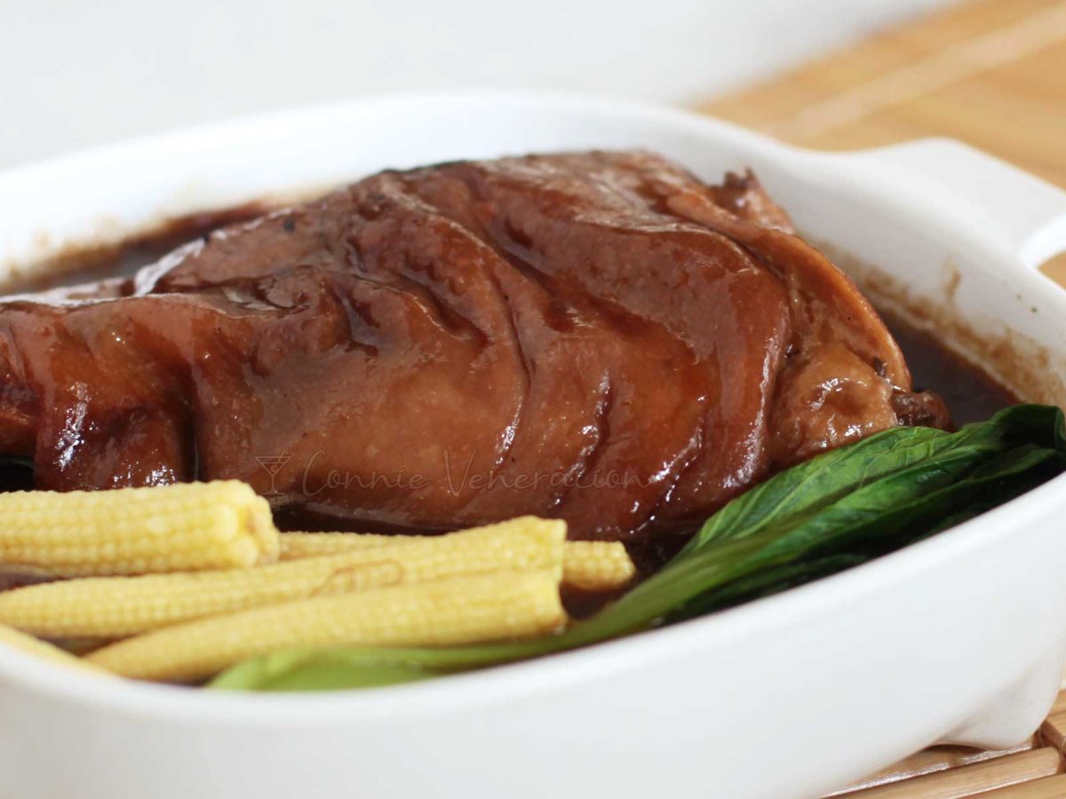 Chinese-style braised pork hock with bok choy and baby corn
