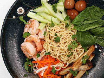 Ramen, cucumber, soy sauce quail eggs, mushrooms, pickled vegetables and shrimps equals Asian cold noodle salad