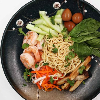 Ramen, cucumber, soy sauce quail eggs, mushrooms, pickled vegetables and shrimps equals Asian cold noodle salad