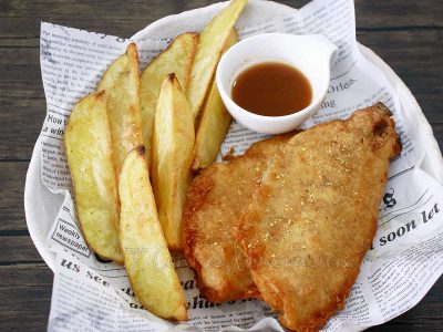 Fish and chips with vinegar for dipping