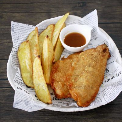 Fish and chips with vinegar for dipping