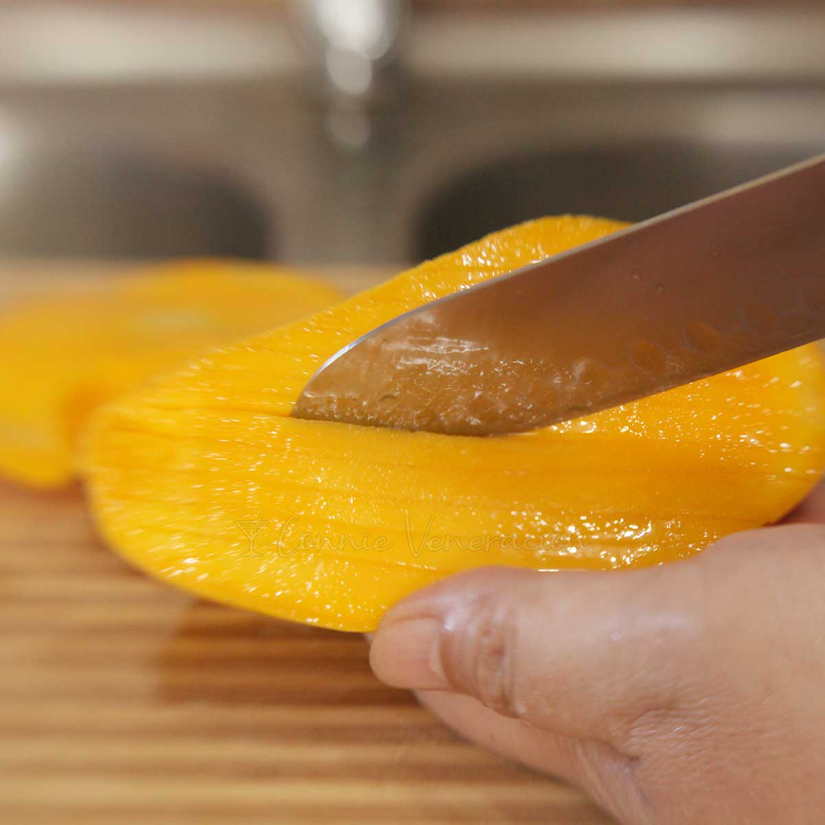 Slicing a fresh ripe mango
