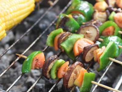 Grilled skewered shiitake and bell peppers, with corn on the side