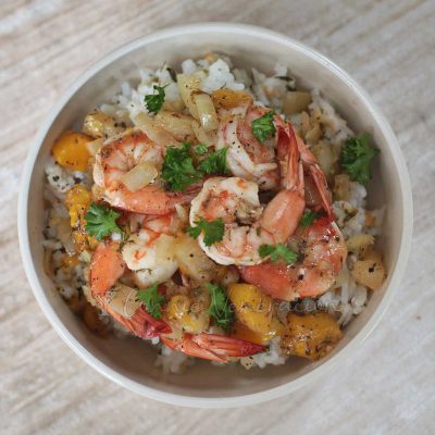Shrimps with pineapple and mango over rice