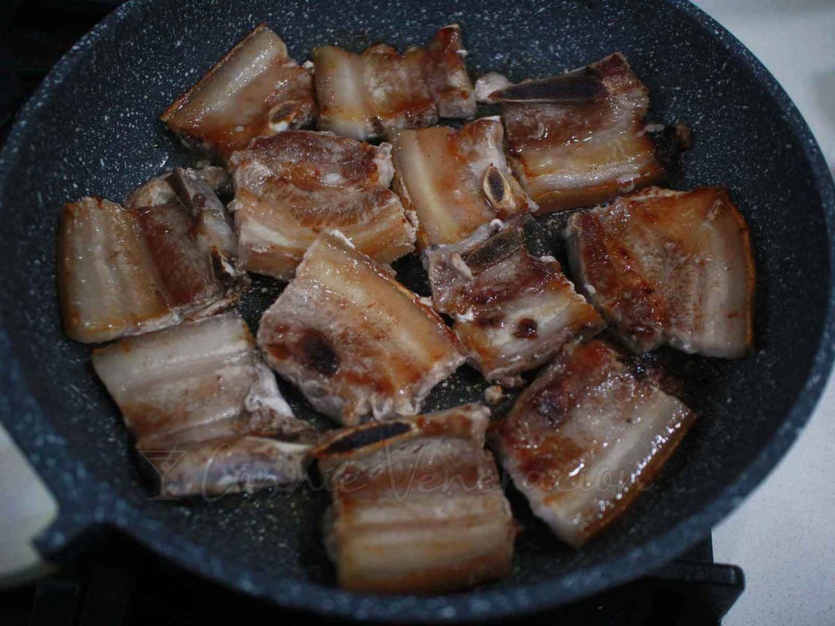Browning pork belly in pan
