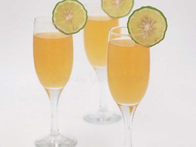 Lime juice mimosa garnished with lime slices