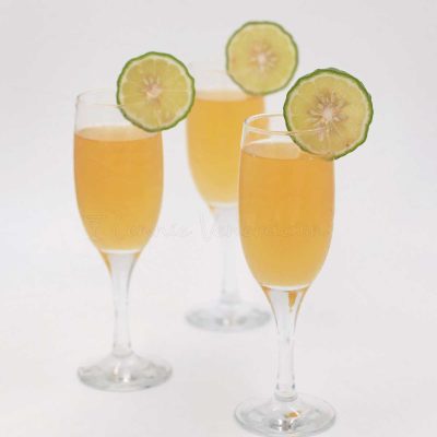 Lime juice mimosa garnished with lime slices