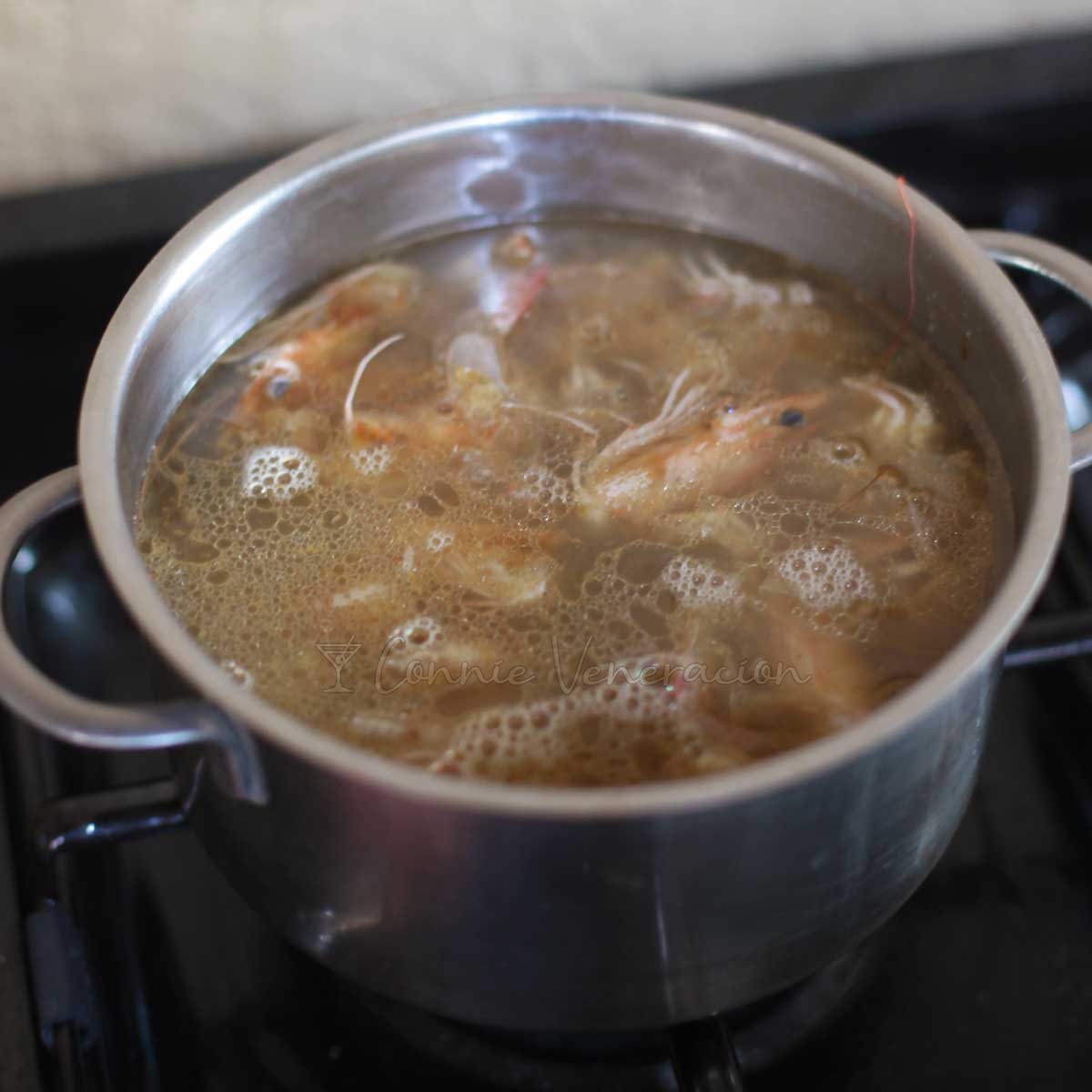 Boiling shrimp heads and shells to make broth