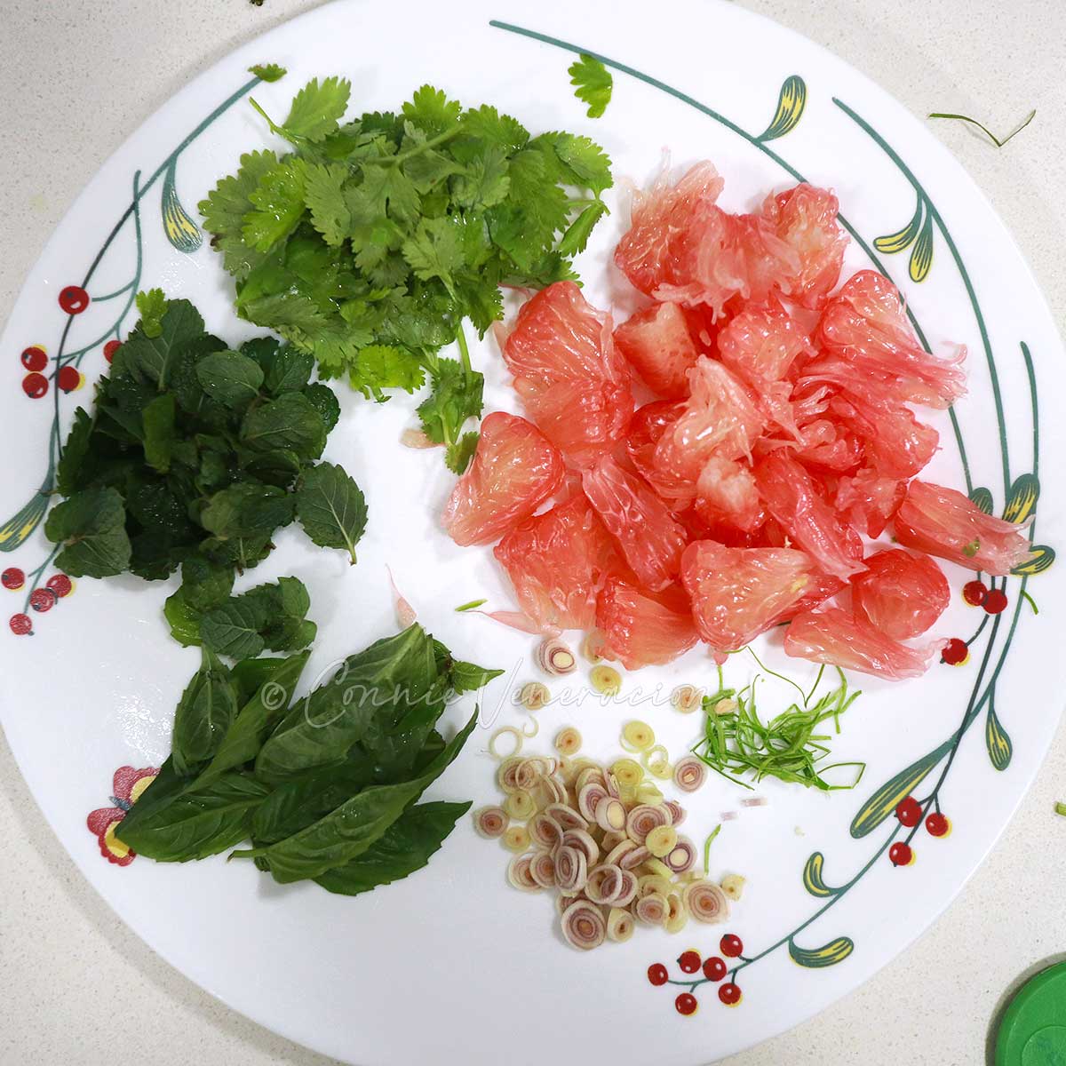Pomelo and herbs on plate