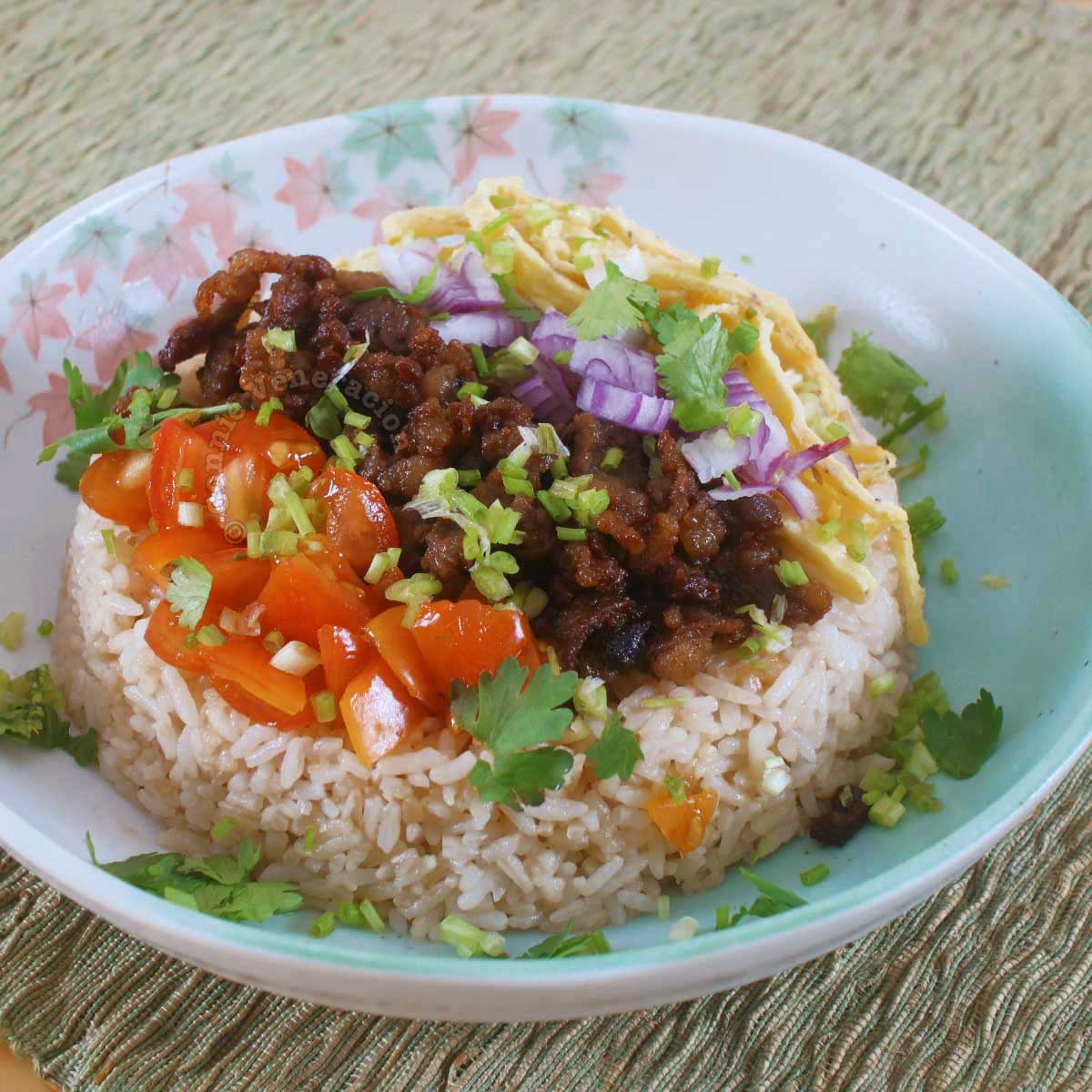 Beef budbod: garlic fried rice, chopped beef, scrambled egg, tomato, onion and scallions.