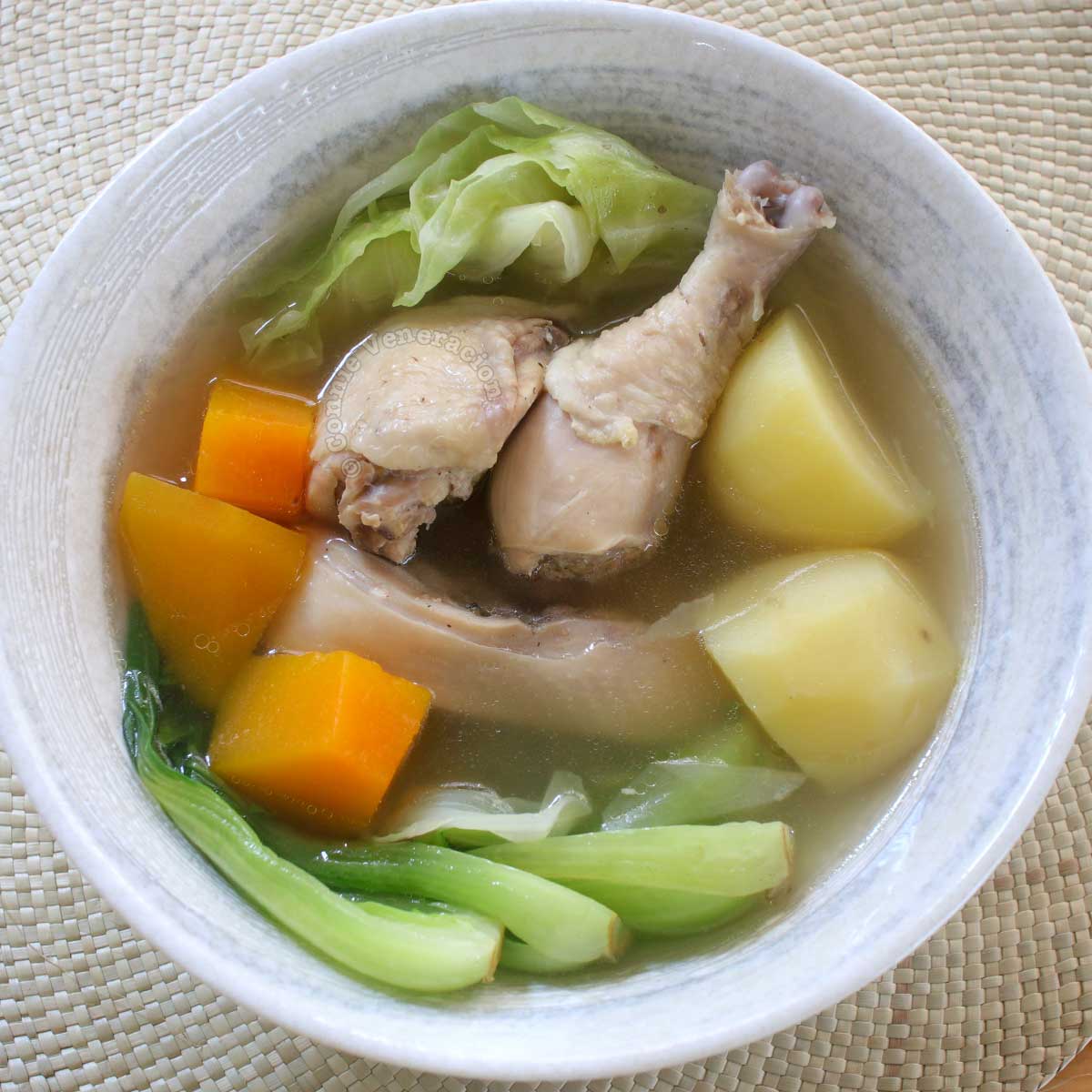 Boiled chicken, cabbage, potatoes, squash and bok choy in serving bowl