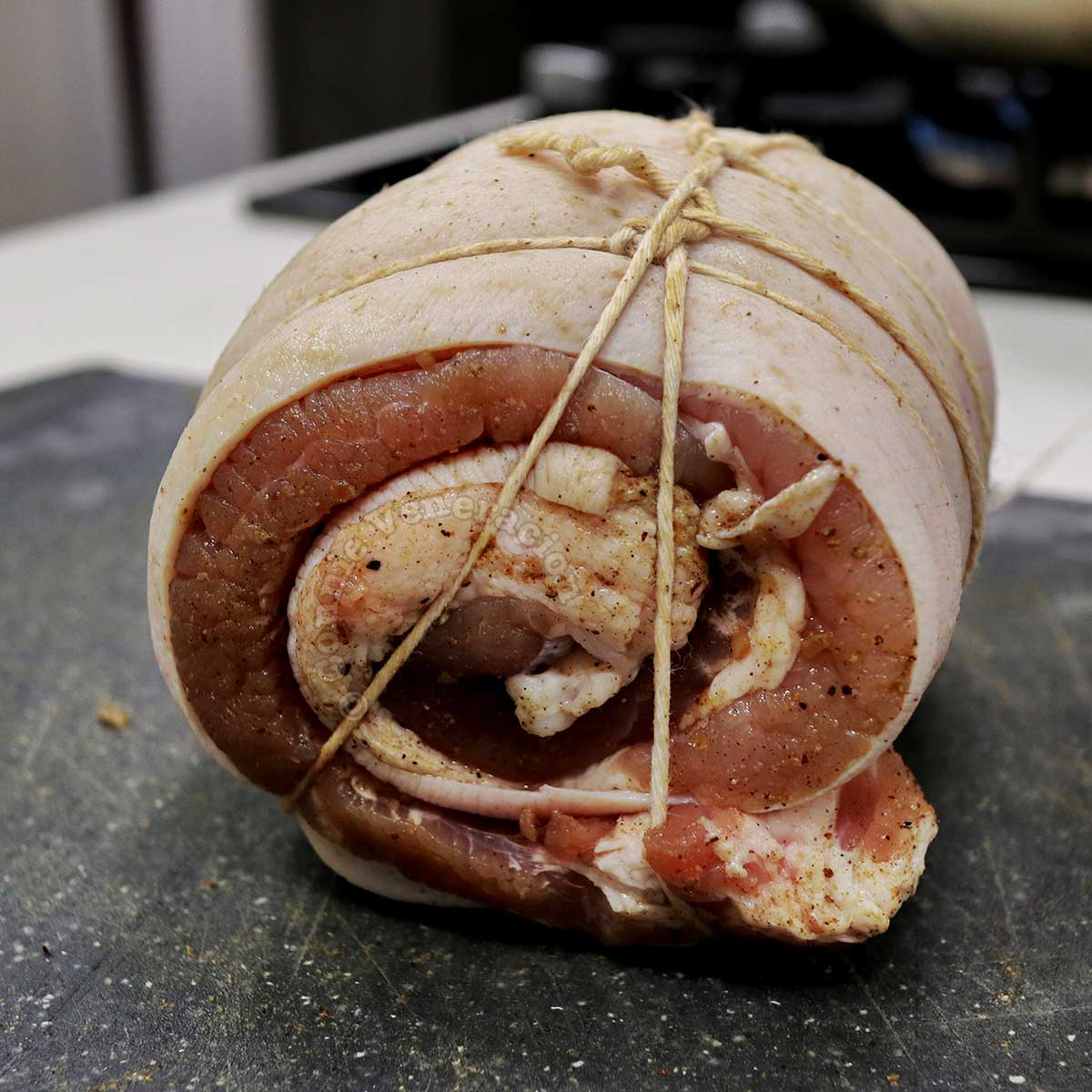 Rolled pork belly tied with kitchen twine
