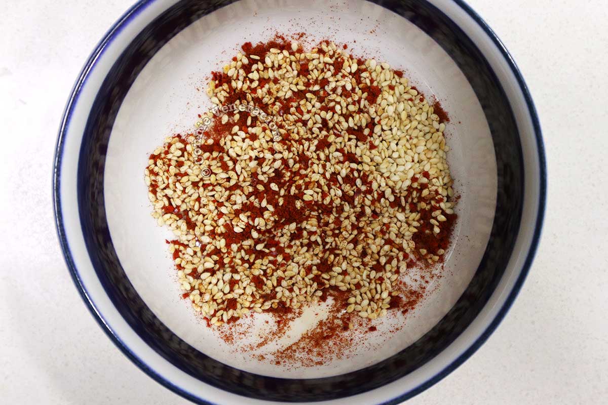 Chili flakes and sesame seeds in bowl