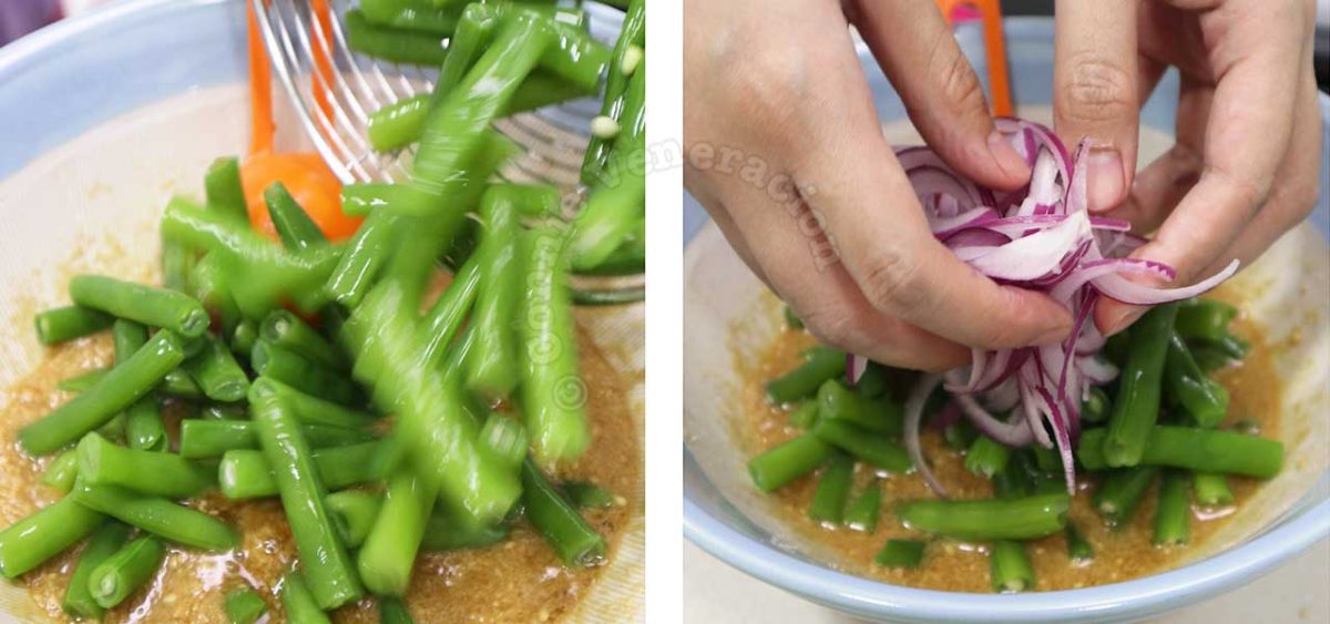Tossing green beans in sesame dressing before adding sliced onion