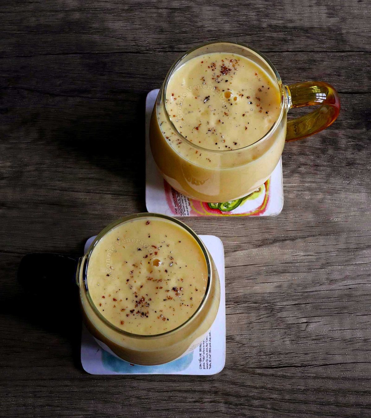 Mango lassi sprinkled with ground spices
