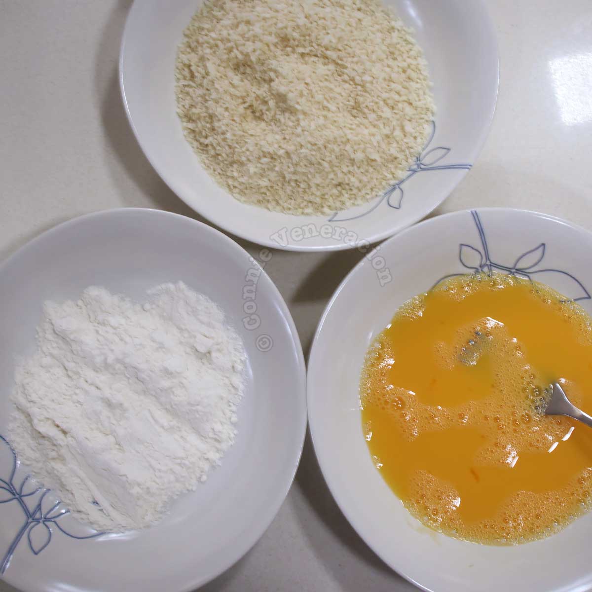 Flour, beaten egg and panko in bowls for cooking tonkatsu