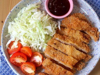 Tonkatsu (Japanese fried pork cutlet) with sauce and shredded cabbage